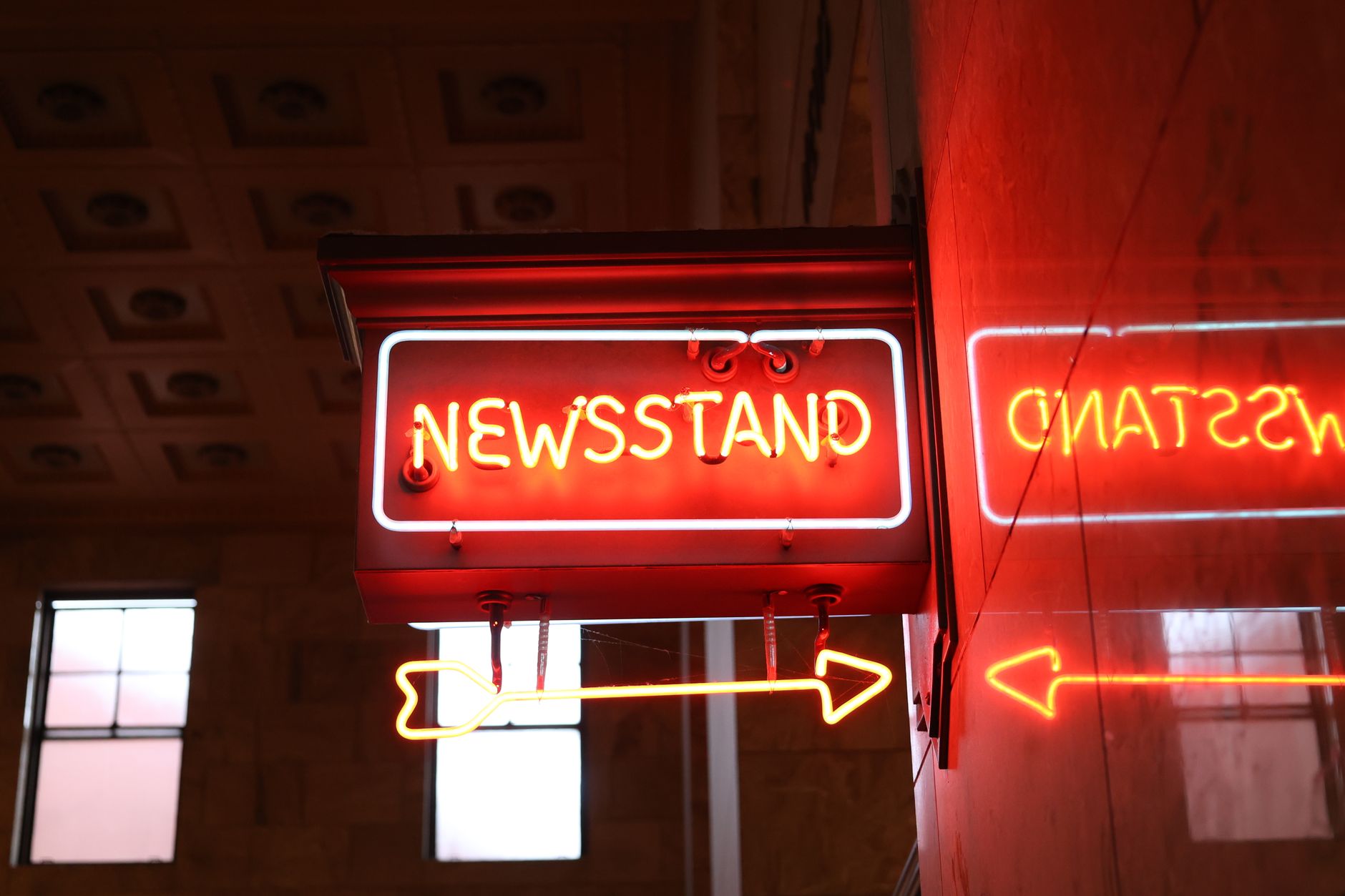 Bright neon newsstand sign reflecting on wall in urban environment. — Mastering SEO Strategies: Your 2022 Comprehensive Guide